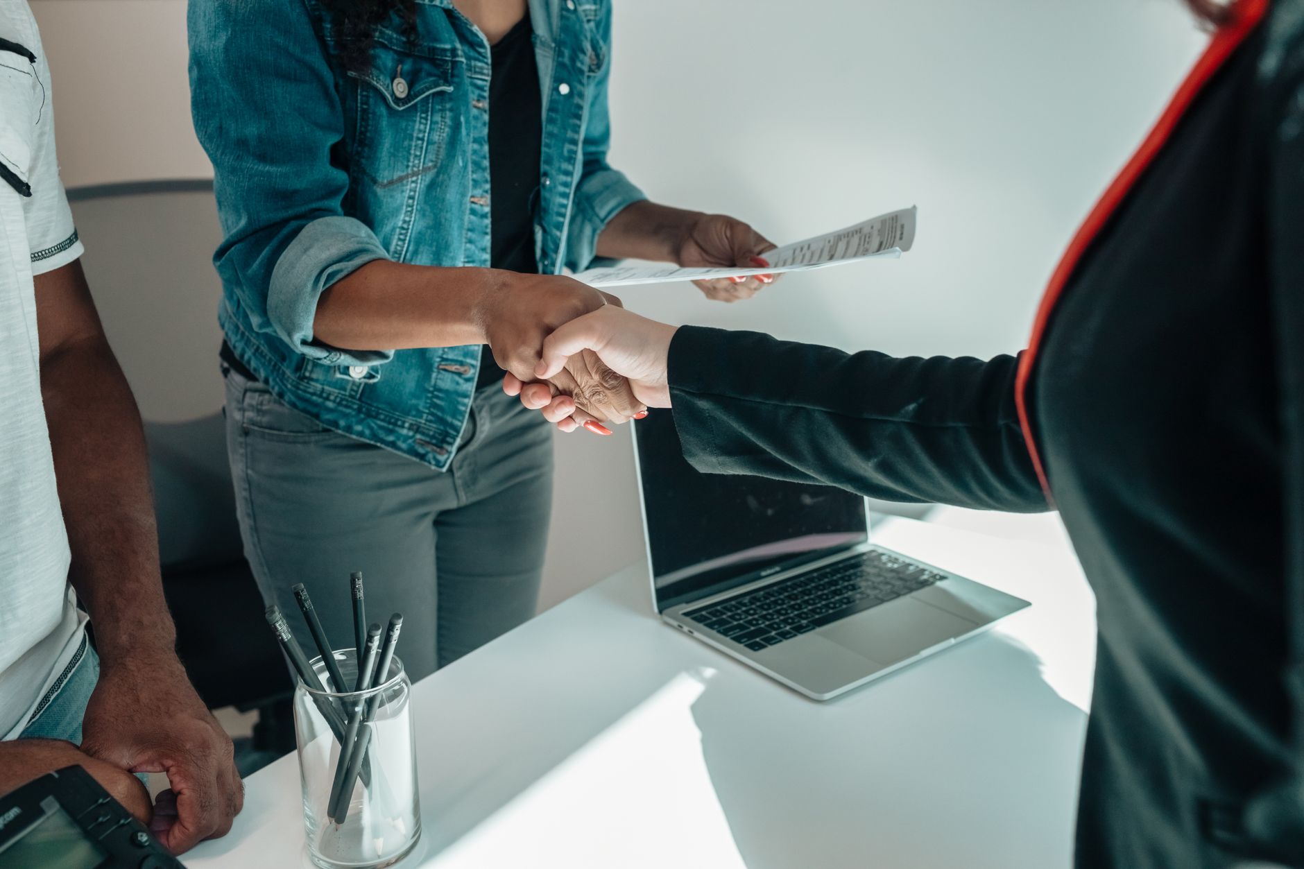 An advisor reviewing documents with a client across a desk
