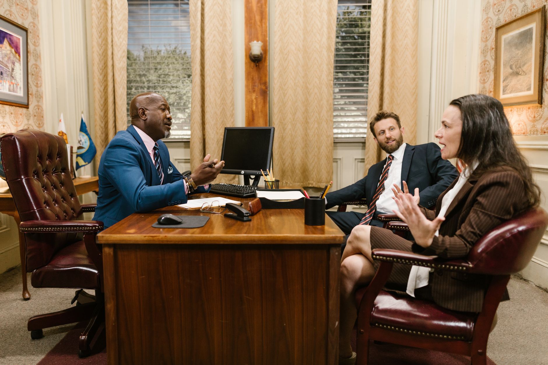 A law office desk with legal books and a phone