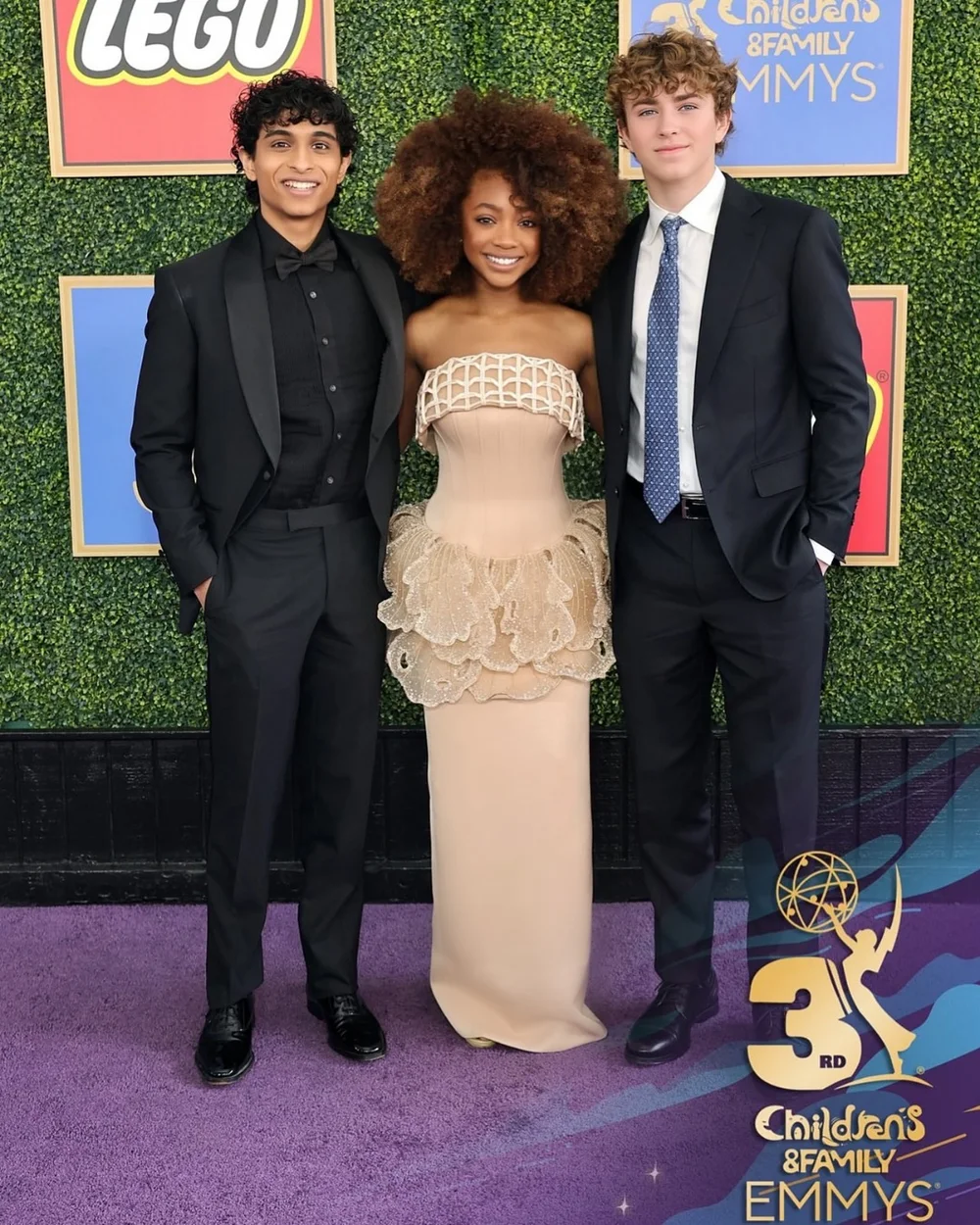 Cream ruffled gown styled for the Children's and Family Emmys purple carpet