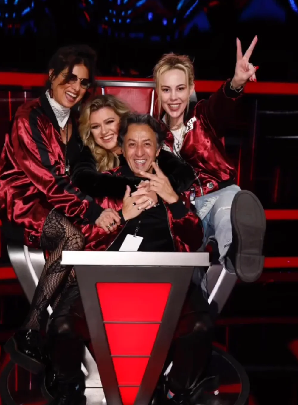 Kelly Clarkson with Candice and the styling team in the red chair on The Voice set