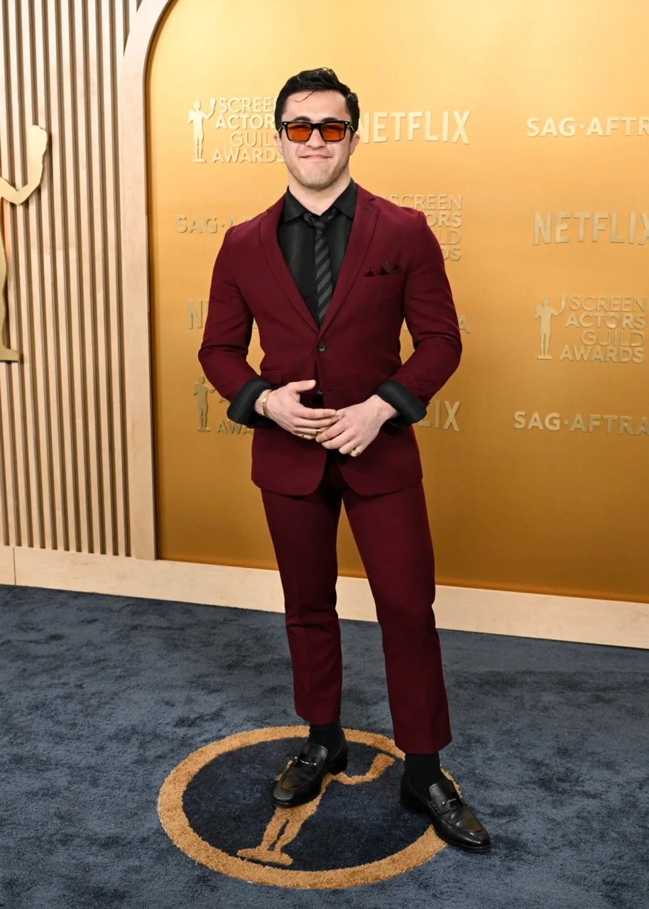 Chris Olsen in an oxblood suit at the SAG Awards