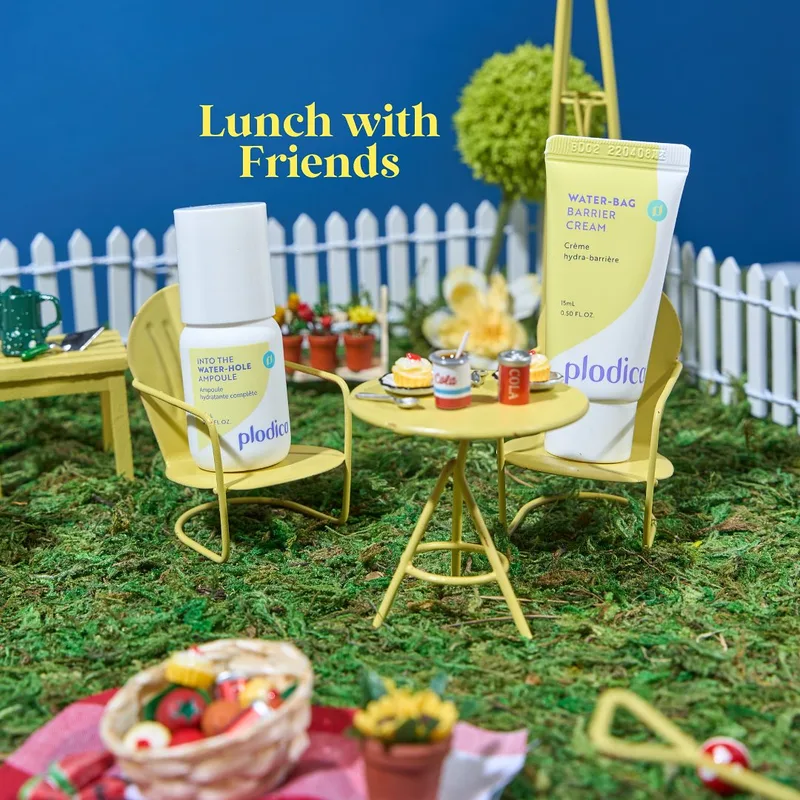 Miniature lunch table set beside a Plodica cream